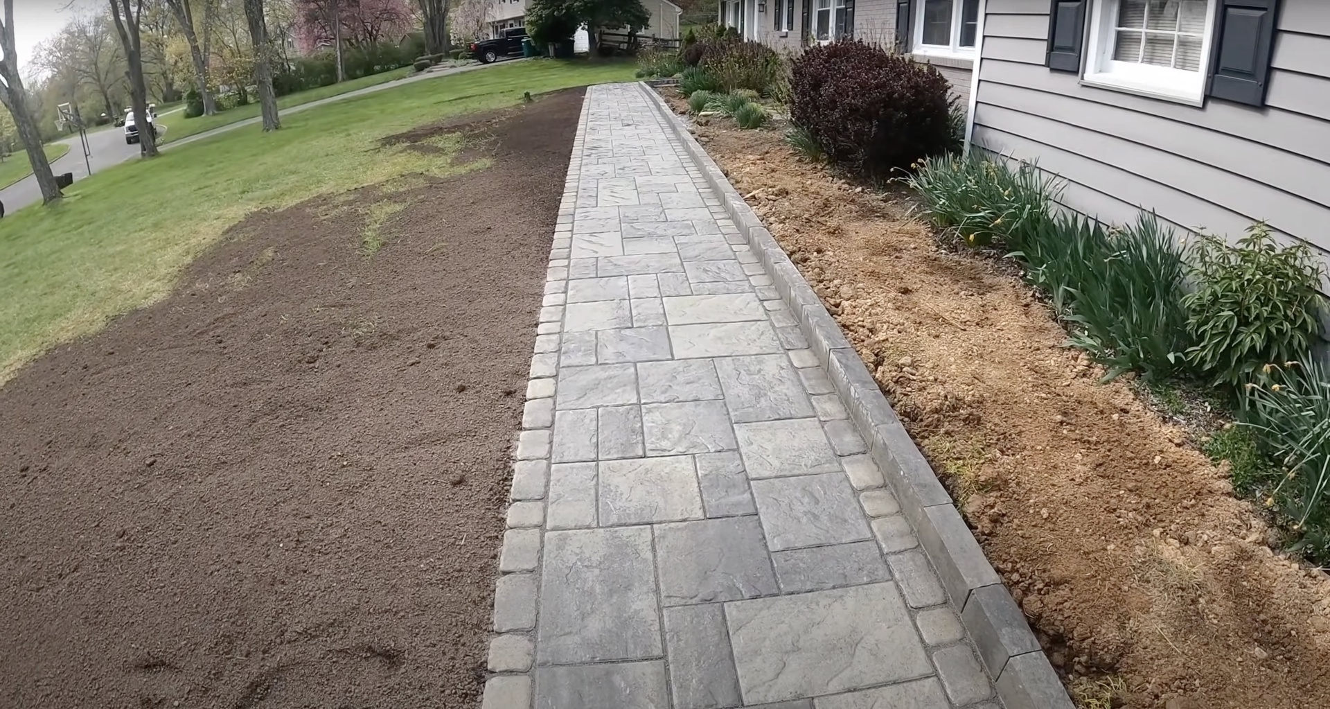 Beautiful stamped concrete walkway installation with decorative pattern in Grapevine, Texas