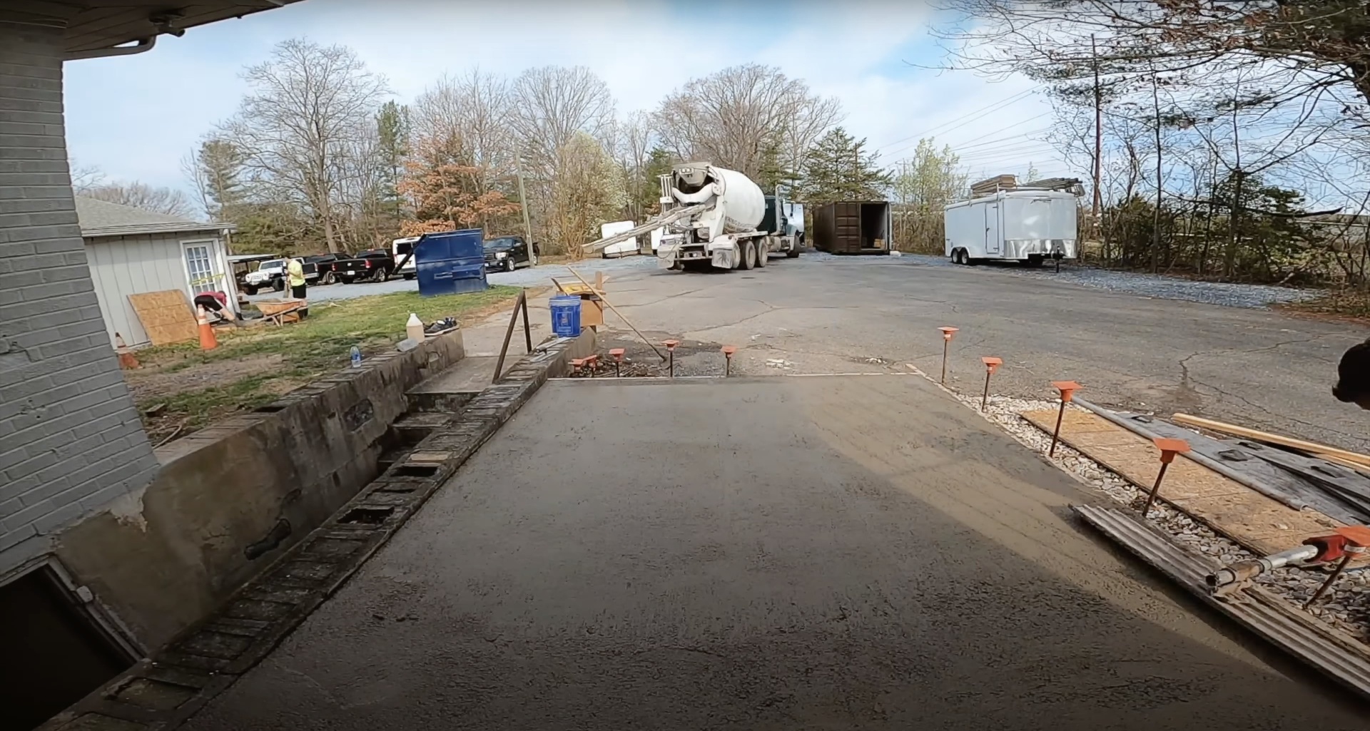 Fresh concrete pour and finishing work for residential driveway project in Grapevine, TX