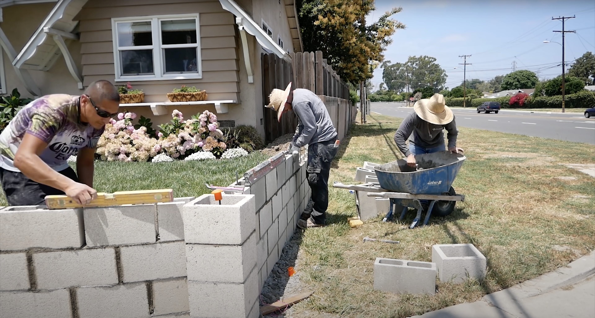 Concrete masonry and foundation work crew building retaining wall in Grapevine, Texas